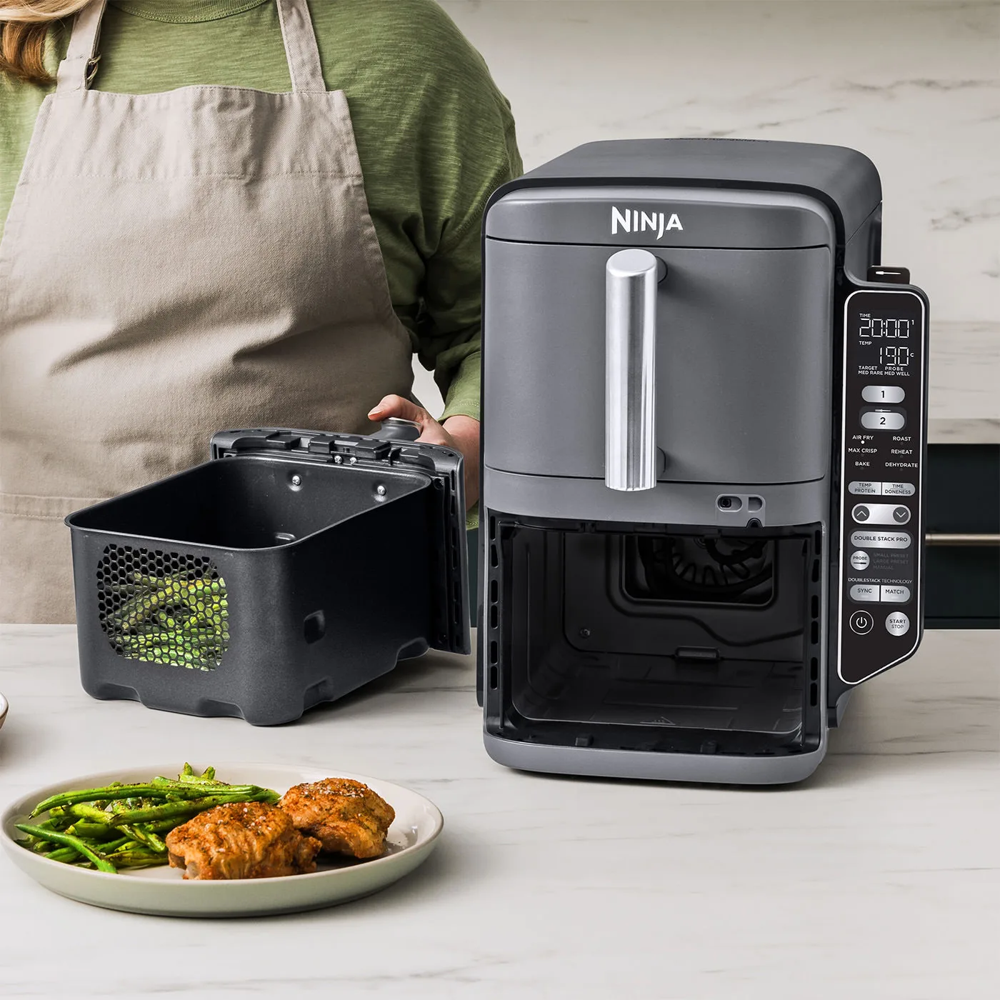 Ninja-R-SL451EU-InUse-Kitchen-OnCounter-ServingFood-Woman_copy